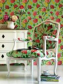 Floral wallpaper and chair upholstered in matching fabric