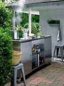Mobile, stainless steel outdoor kitchen with ceramic hob, sink & fridge