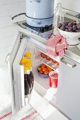 Open fridge in Scandinavian summer house