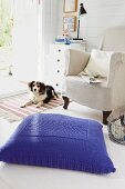 Large floor cushion with blue knitted cover
