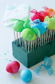 Easter eggs drying on toothpicks