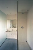 Modern bathroom with glass shower partition