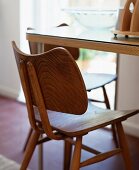 50s-style wooden chair at a table