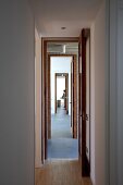 View through row of narrow, open doors