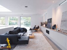 Generous living room with black sofa