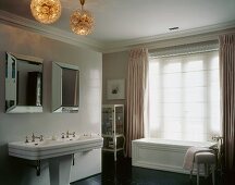 Bathroom with bathtub, double sinks & mirrors