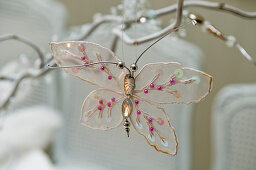 Christmas tree decoration - butterfly ornament hanging from twig
