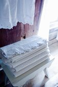 White lace cloths on white wooden stool