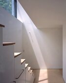 White hallway with staircase