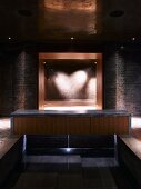 View from pool of heart-shaped lighting effect in luxurious spa