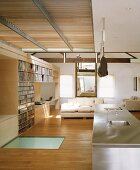 Open-plan interior with kitchen island and light parquet flooring