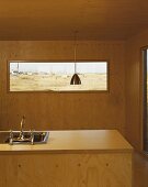 Wood-clad kitchen island and interior walls
