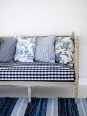 Rococo-style bench and cushions with rustic motifs