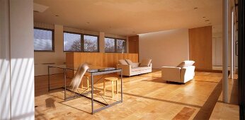 Living room with minimalist furnishings and parquet floor