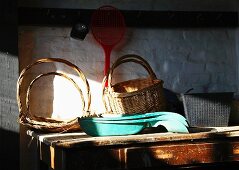 Baskets on wooden table in shed