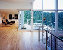 Large living room with glass wall and balcony