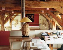 Wicker lamp with lampshade - home office on gallery in old, converted barn