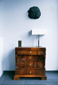 Antique chest of drawers with Art-Deco table lamp