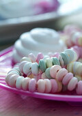 A candy necklace on a plate