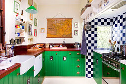 Retro kitchen with wooden worksurface and green-painted base units