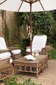 Rattan furniture and parasol on terrace