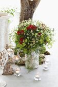 Summery flower bouquet and tea lights