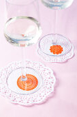 Doilies with stamp motifs used as coasters