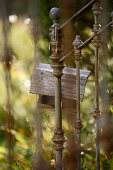 Bird table hanging on metal railing