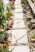 Mediterranean-style garden path of large slabs and pebbles