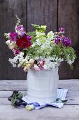 Wild flower bouquet with stocks, white yarrow and ground elder