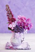 Pink hydrangeas and summer lilacs in a porcelain vase