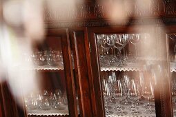 Wine glasses in antique display cabinet