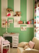 Green wall with white stripes in child's bedroom