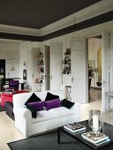 Elegant salon with sofa sets and white double doors
