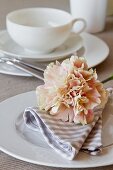 Carnation on breakfast place setting