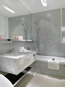 Modern silver tiled bathroom