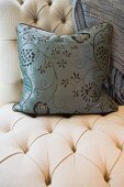 Contemporary decorative throw pillow on chair