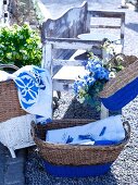 Wicker basket and hand bag, the bottom halves painted blue, for storage