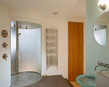 Oval shower area on platform in designer bathroom