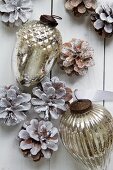 Silver Christmas decorations and pinecones