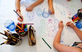 Children drawing on table