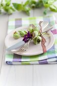 Spring table setting with hyacinth florets and hellebores