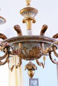 Traditional Hanging lamp made of carved wood with gold plated animal and plant motifs