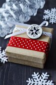 Festive gift box decorated with button and ribbons