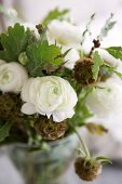 Bouquet with oak leaves and white ranunculus
