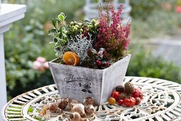 Autumnal arrangement on garden table