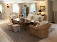 Upholstered, wicker sofa set, coffee table with drawers and solid wood, cubic stools in restored country house