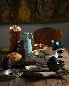 Winter shopping trends: soup tureen and bowls, vases, jugs and glasses on wooden table