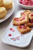 Biscuits on serving dish decorated with postage stamps
