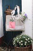 Hand-sewn shopping bag made from beige and pink linen and decorated with lace trim